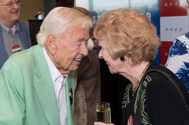 friends greeting at 90th birthday celebration