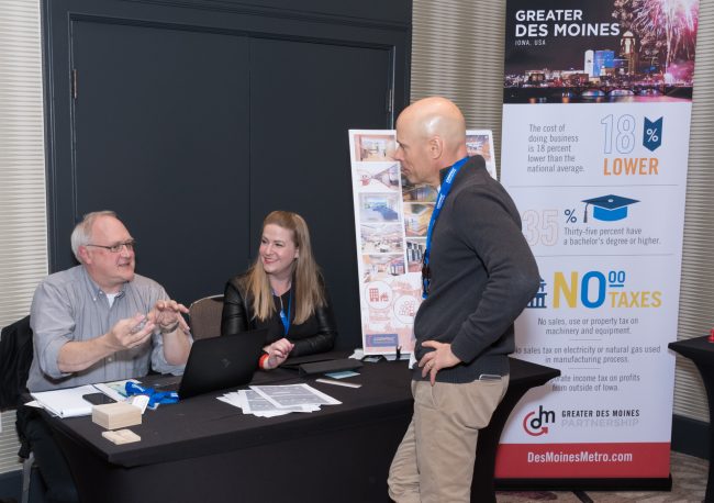 Vendor interacting with attendee at trade show