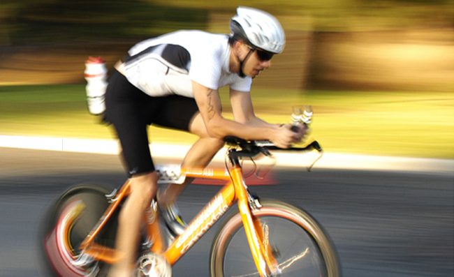 Triathlete riding bike in race